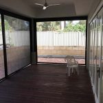 enclosed wooden deck in backyard with ziptrak blinds fitted