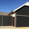 mandurah home with outdoor dark shade blinds protecting it from the sun and rain.