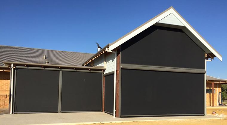 mandurah home with outdoor dark shade blinds protecting it from the sun and rain.